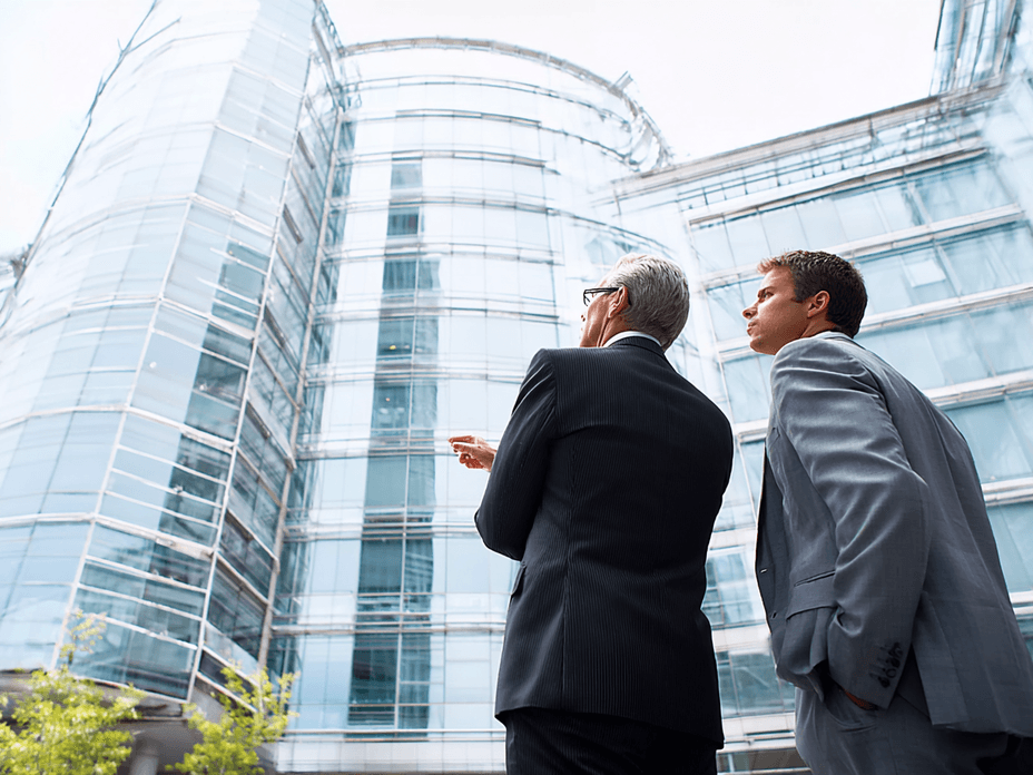 men-looking-at-commercial-building-ai
