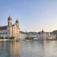 Jesuit church in the old town of Lucerne at dusk directly on the lake