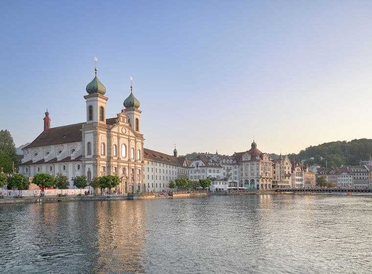 Jesuit church in the old town of Lucerne at dusk directly on the lake
