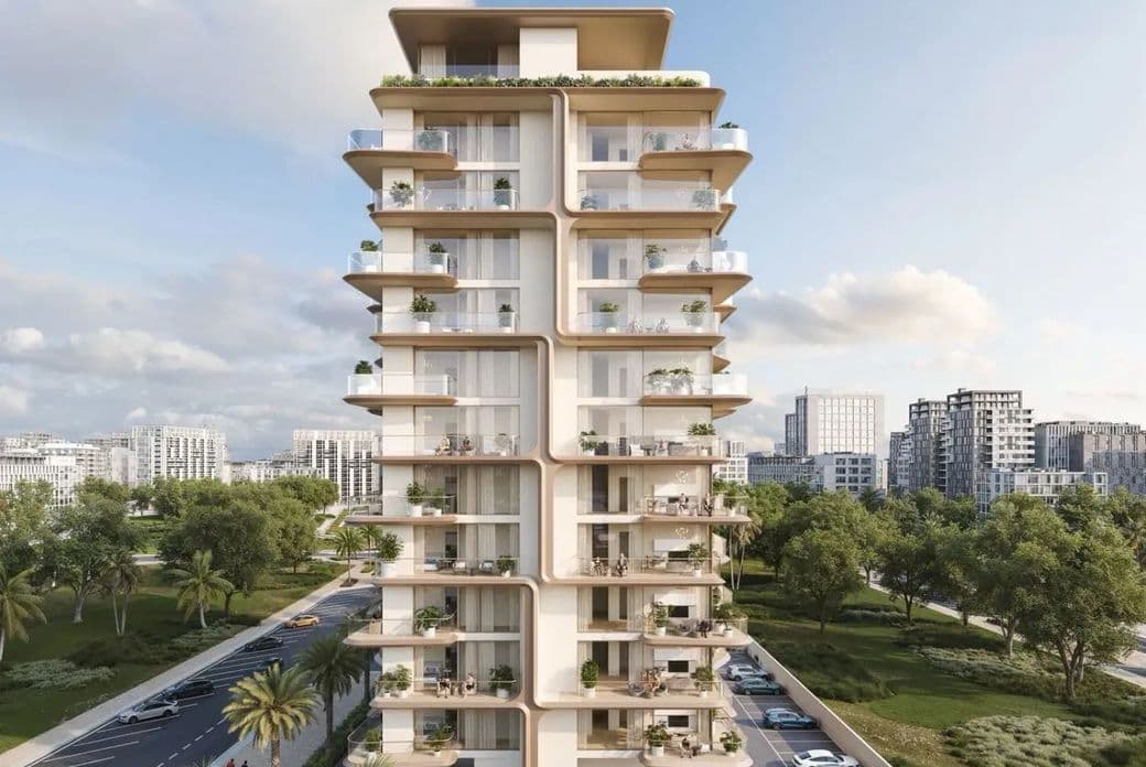 A modern multi-story residential building with balconies and rooftop greenery, set amidst trees and a cityscape under a partly cloudy sky.