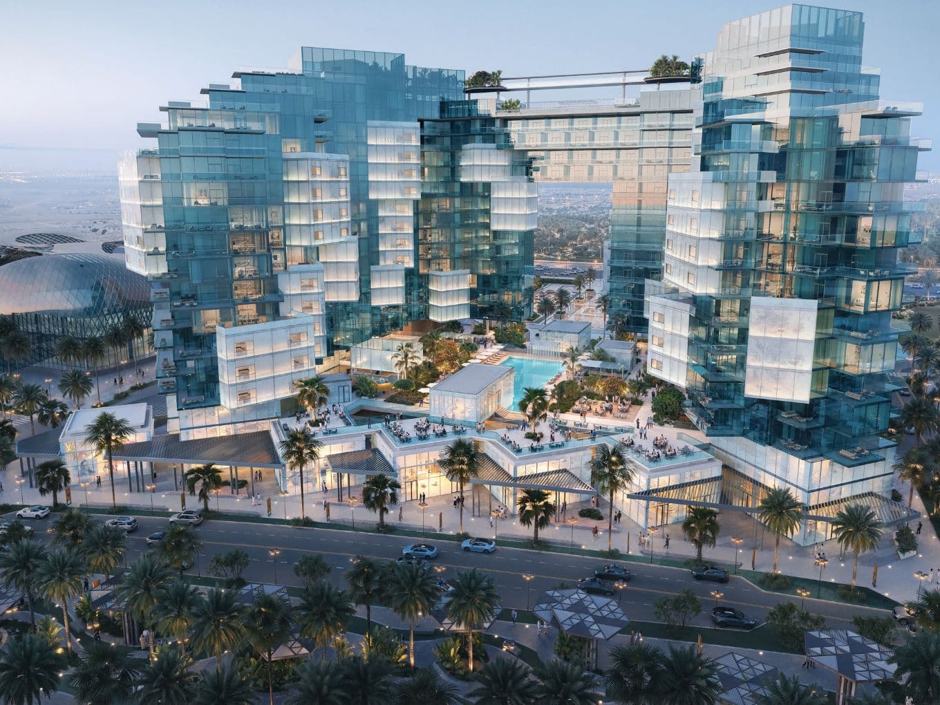 Futuristic glass buildings with intricate designs, surrounding a pool area, set in an urban environment with palm-lined streets.