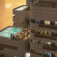 A modern high-rise building with balconies, featuring luxurious penthouses, private pools, palm trees, and lounge chairs against a sunset backdrop.