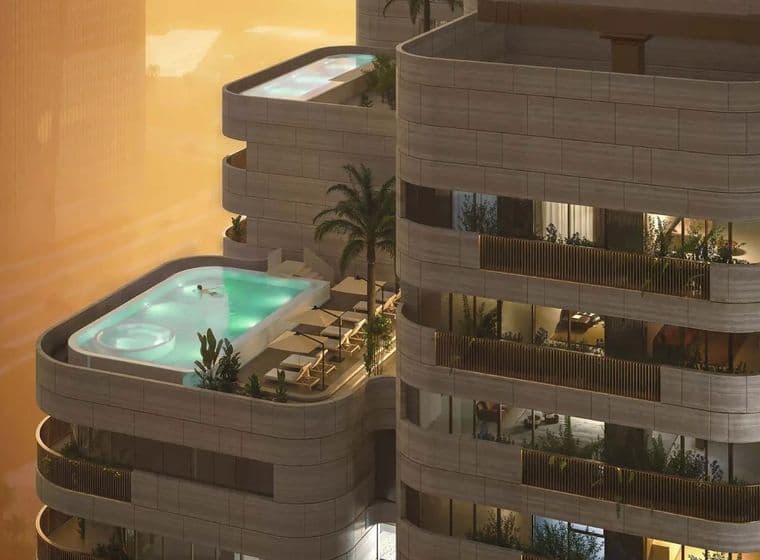A modern high-rise building with balconies, featuring luxurious penthouses, private pools, palm trees, and lounge chairs against a sunset backdrop.