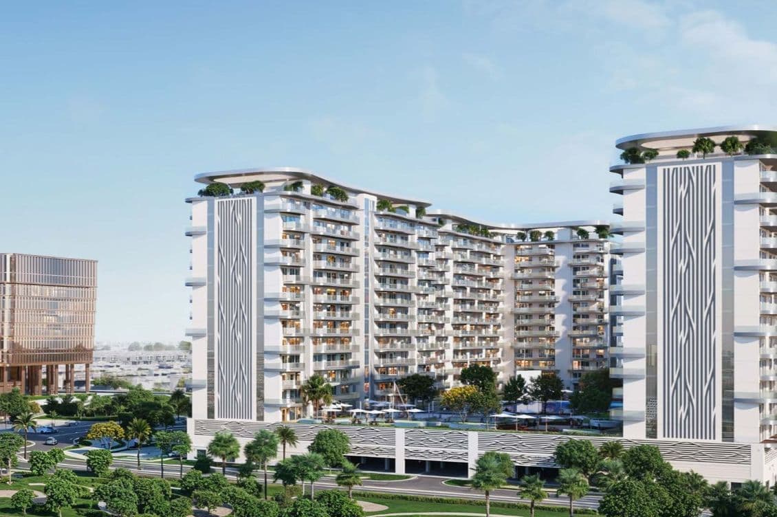 Modern residential complex with multiple high-rise buildings, featuring geometric facades, greenery, and surrounding roads and landscaping.