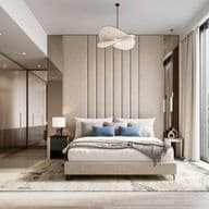 Modern bedroom with large window, beige tones, upholstered headboard, double bed, blue cushions, and contemporary hanging light fixture.