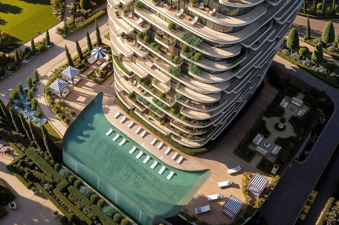 Aerial view of a luxury skyscraper with curved balconies, spacious terrace, pool with a waterfall feature, and landscaped garden.