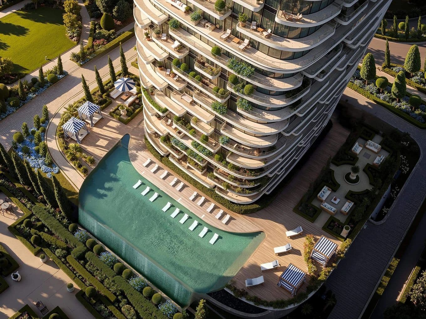 Aerial view of a luxury skyscraper with curved balconies, spacious terrace, pool with a waterfall feature, and landscaped garden.