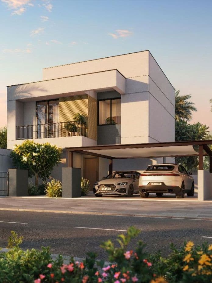 Modern two-story house with palm trees, two cars in the driveway, and a well-maintained garden under a clear sky.