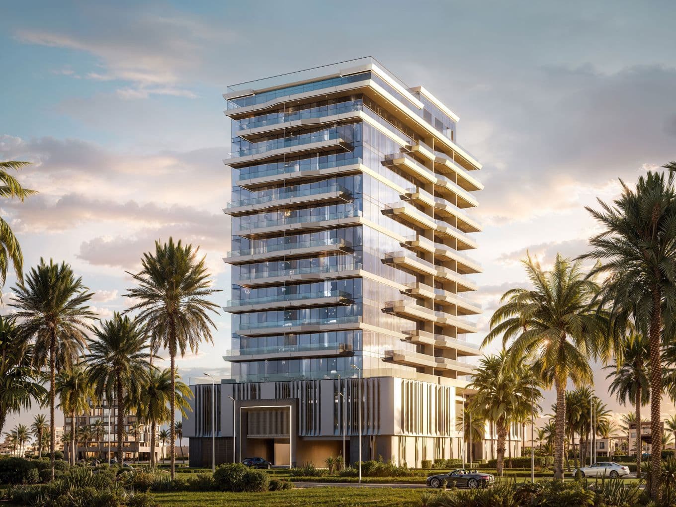 Modern glass building with multiple balconies, surrounded by palm trees, set against a partly cloudy sky with sunlight.