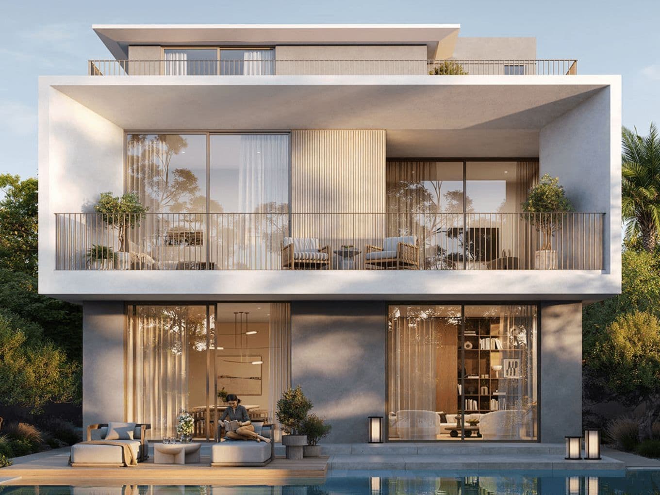 Modern multi-story house with large glass windows, balconies, outdoor seating, and a pool. Surrounded by greenery under a clear sky.