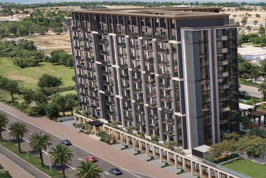 Aerial view of a modern, multi-story residential building with large windows, surrounded by palm trees and a road with passing cars.