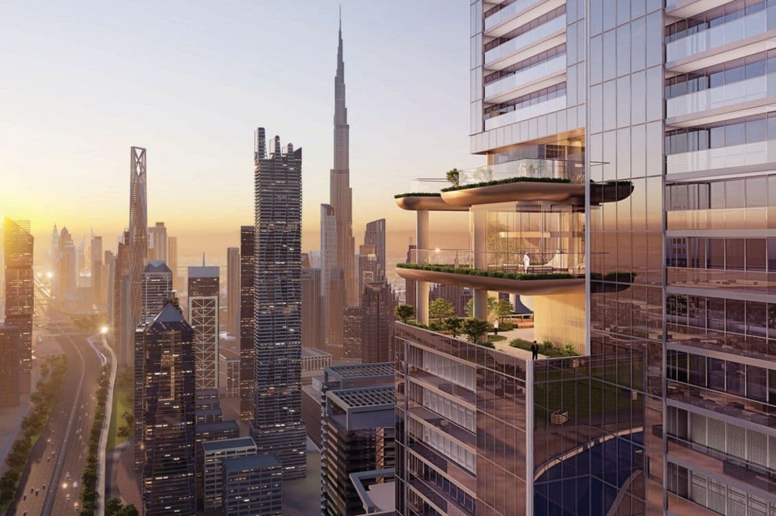 Sobha Skyparks at sunset with Burj Khalifa in the background, featuring a luxurious balcony with greenery in the foreground.