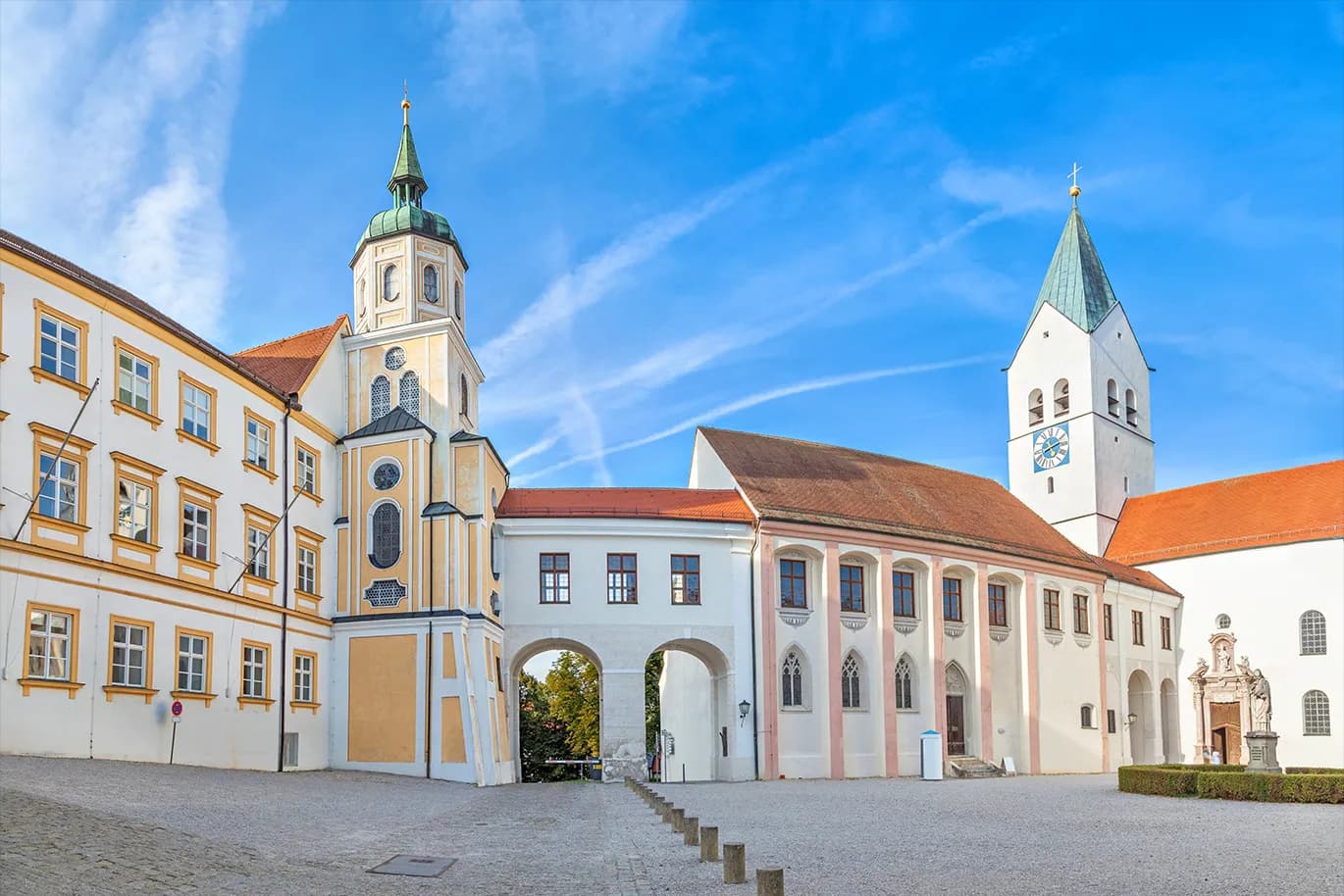Courtyard of Freising Cathedral with two towers – historic residential area in Freising