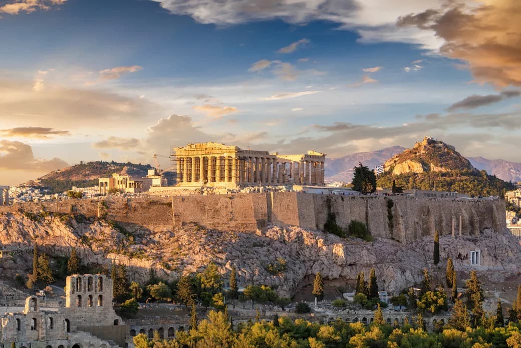 Panoramic golden hour view of the Acropolis hill and the Parthenon in Athens