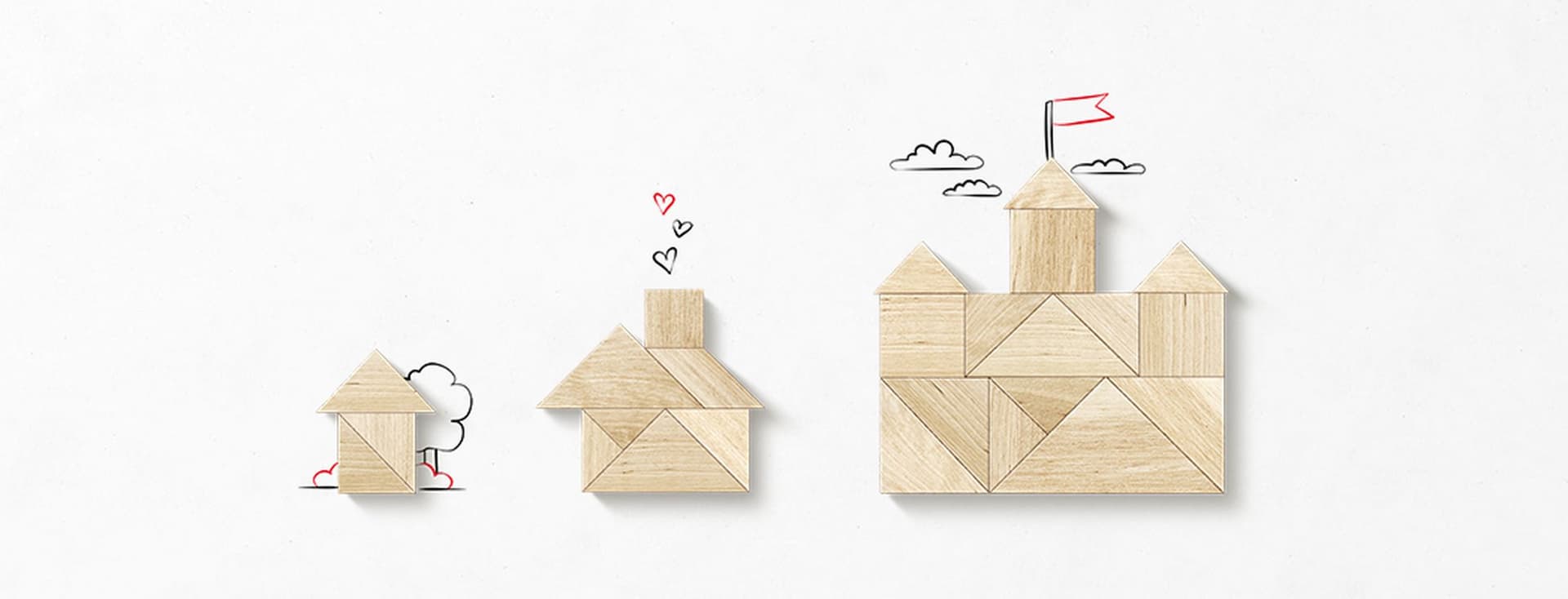 Cardboard houses in different sizes symbolizing the diversity of real estate segments