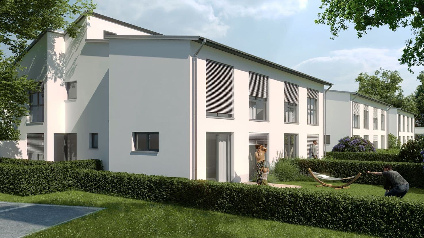 Seitenansicht von Neubau-Reihenhäusern mit stilvoller Steinfassade und gepflegtem Garten