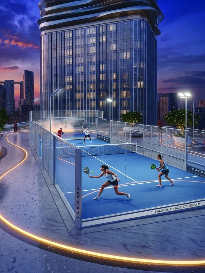 Nighttime city skyline with a futuristic glass tower and a rooftop glass-walled padel court where players hit shots.
