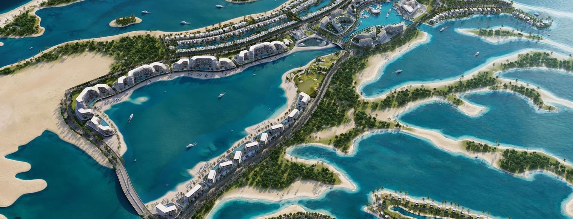 Aerial view of a luxurious island resort with villas, pools, and lush greenery surrounded by blue ocean water.