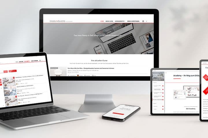 Engel & Völkers website displayed on a monitor, laptop, tablet, and phone.