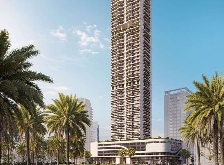 Street-level view of the full ALTA V1EW tower with palm-lined roads, sleek modern podium, and high-rise architecture set against surrounding towers and a clear blue sky.