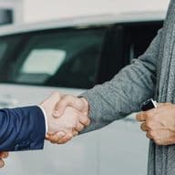 Business professionals shaking hands to finalize a successful agreement in a professional setting