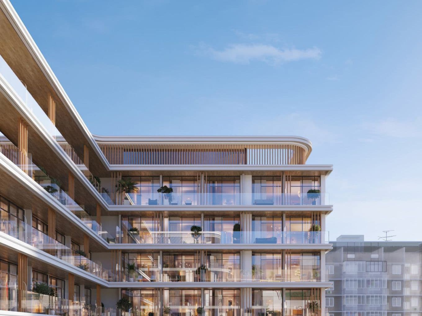 Modern multi-story building with glass balconies and wooden accents under a clear blue sky, featuring plants on several balconies.