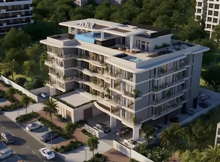 Modern multi-story apartment building with balconies, rooftop pool, and greenery, surrounded by lush trees and parked cars along the street.