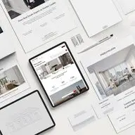 Flat lay arrangement of real estate marketing materials including iPads, smartphones, and print documents displaying luxury property listings, architectural sketches, and interior designs in a clean white minimalist style