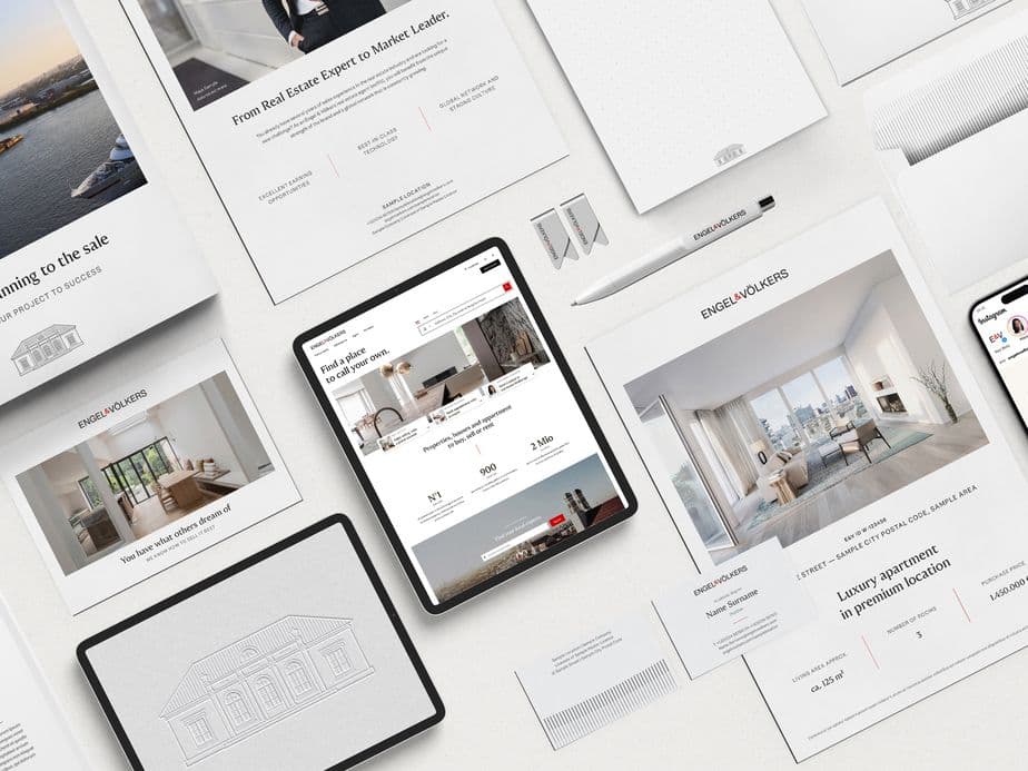 Flat lay arrangement of real estate marketing materials including iPads, smartphones, and print documents displaying luxury property listings, architectural sketches, and interior designs in a clean white minimalist style