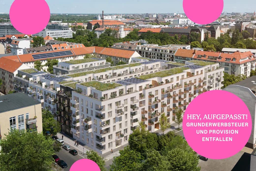 Aerial view of modern white apartment blocks with green roofs amid a red-roofed city, lush trees, and large pink circular overlays obscuring parts of the scene.