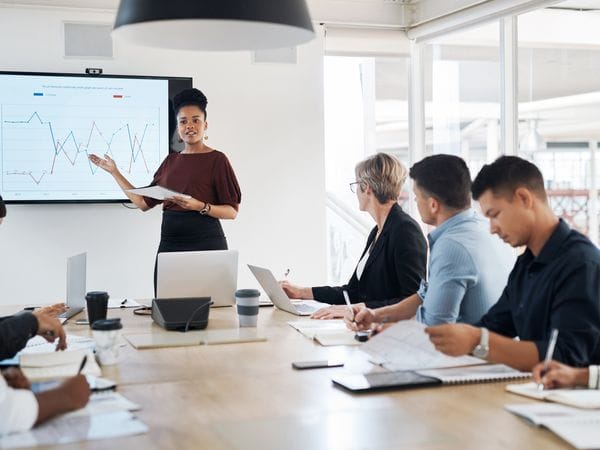 Few people gathering around the table to discuss numbers
