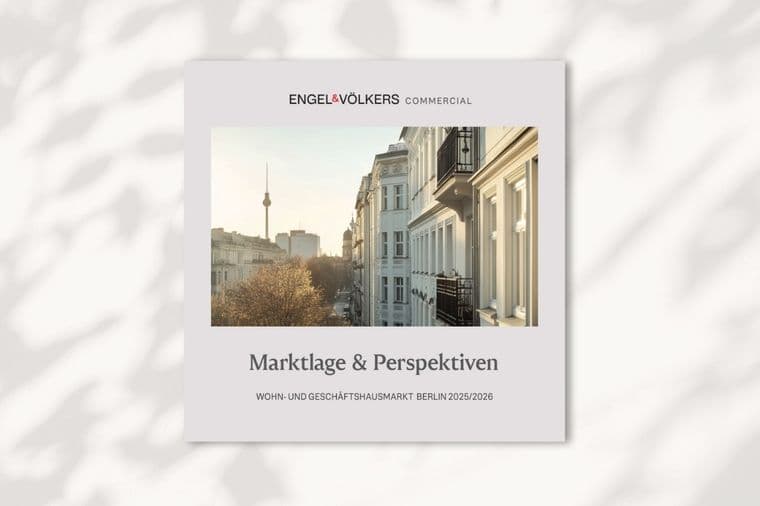 Cover of a real estate brochure showing a city street view with trees and buildings, and a distant landmark tower under a clear sky.