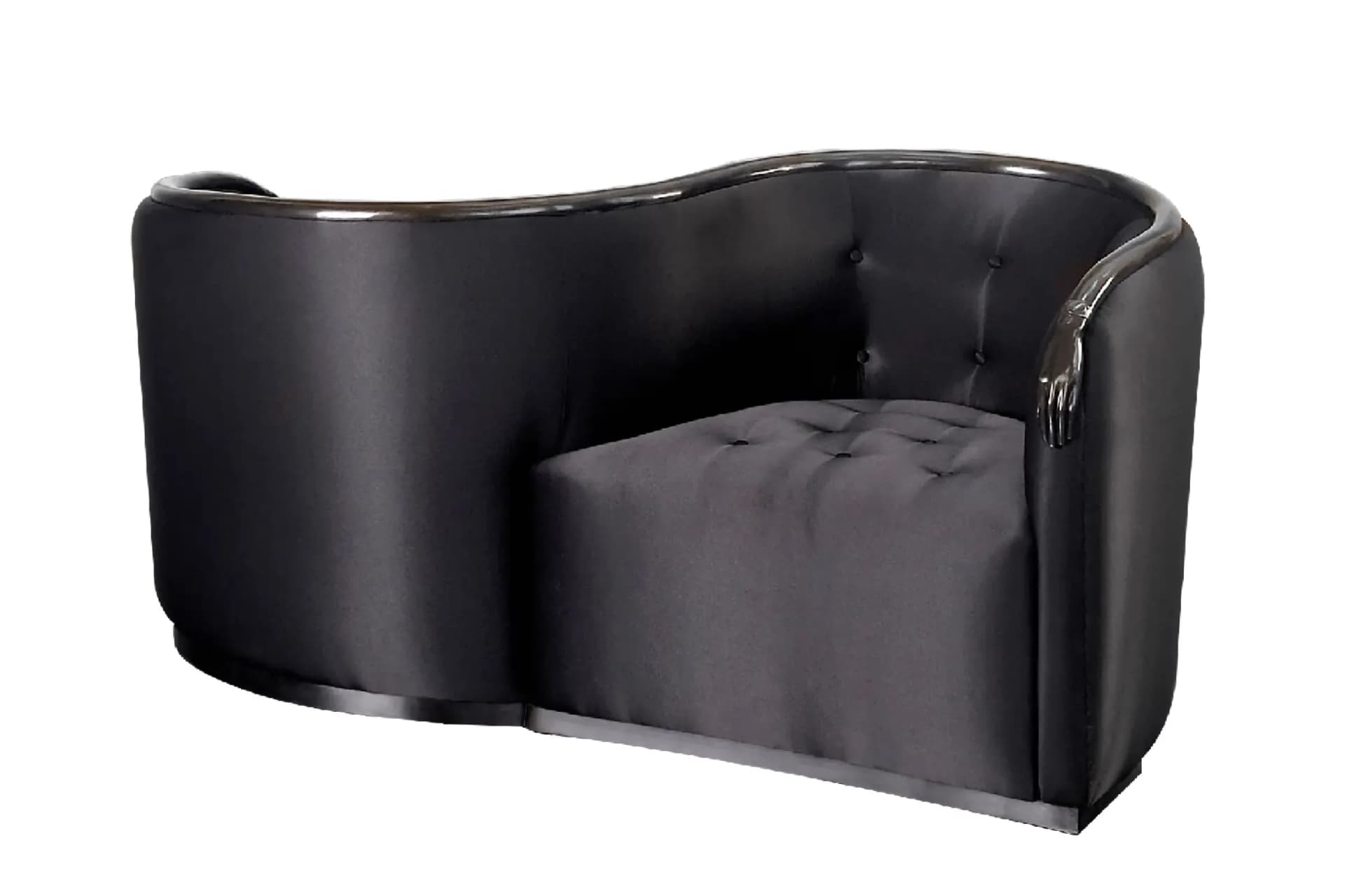 Black curved leather sofa with a rounded back and a tufted single-seat cushion.