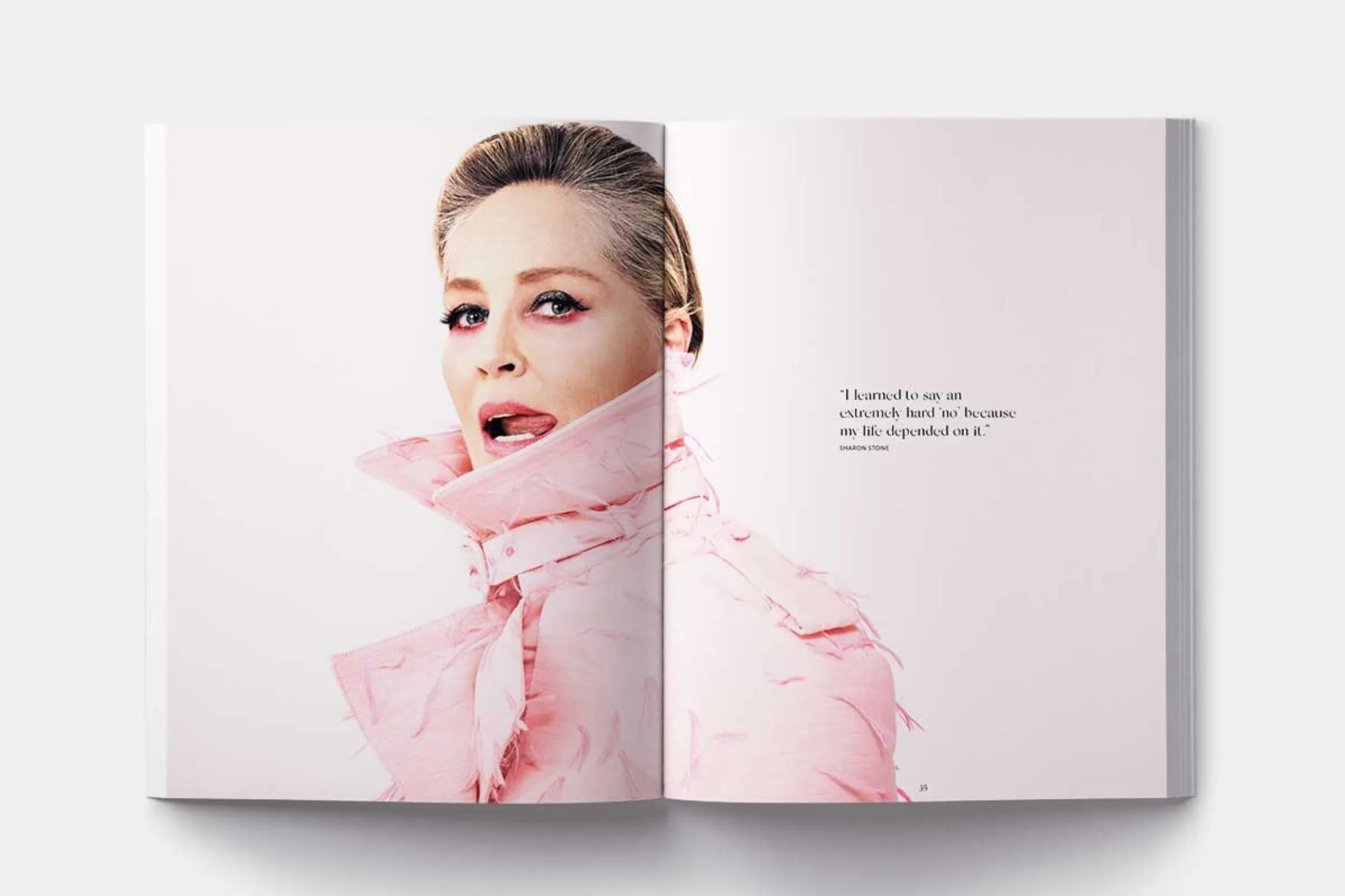 A spread from a magazine featuring a close-up portrait of a woman wearing a pink scarf and makeup, with a quote on the right-hand page.