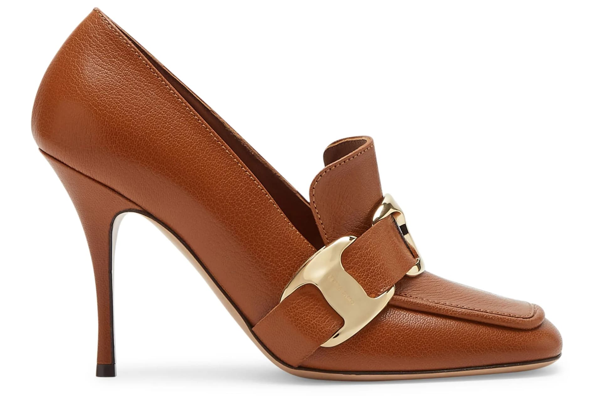 Brown leather high-heeled pump with a gold-toned horsebit strap across the vamp.