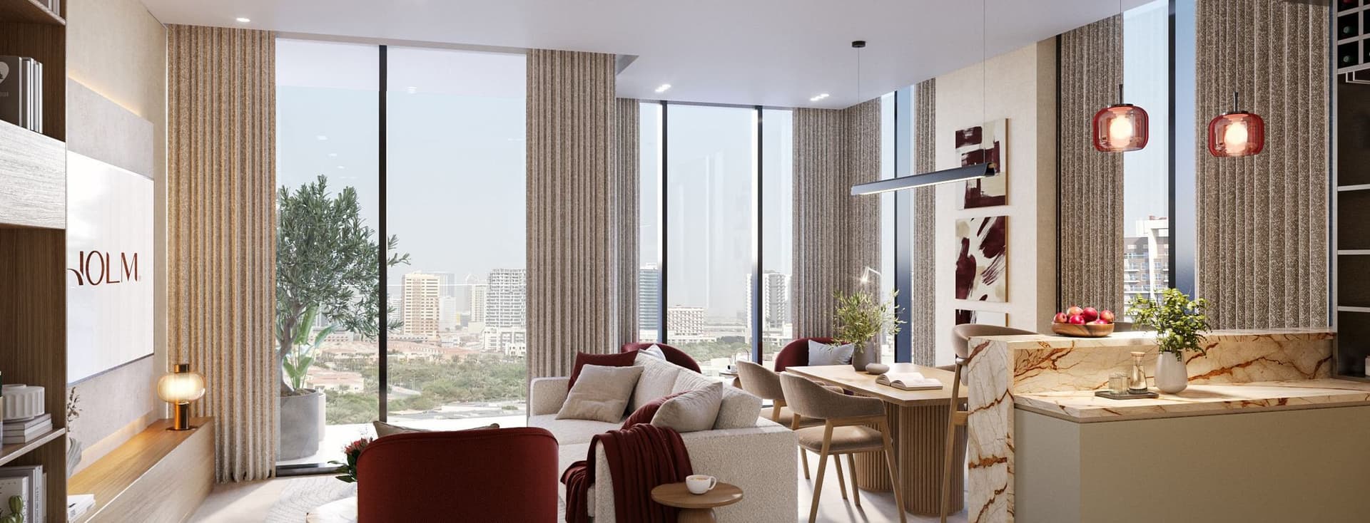 Modern living room with large windows, a cozy sofa, red chairs, and a marble kitchen island. Cityscape view in the background.