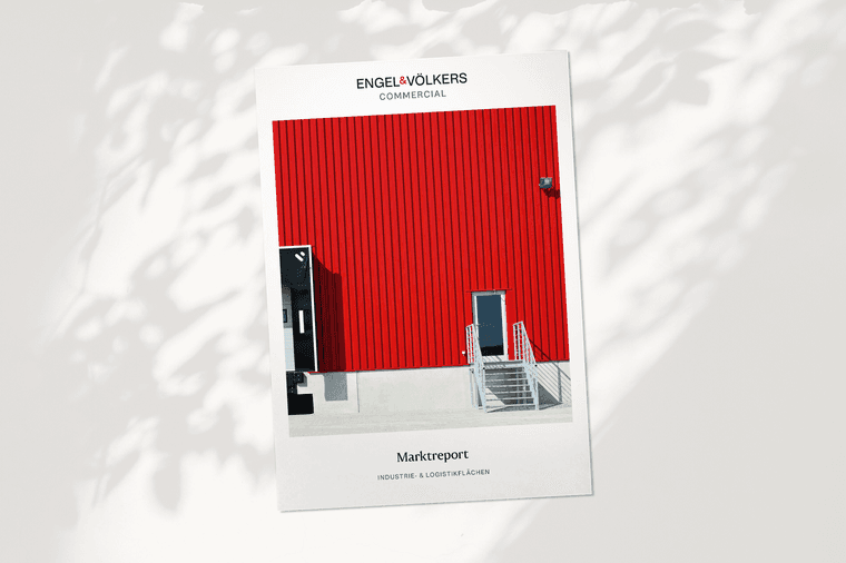Cover of Engel & Völkers commercial market report featuring a red industrial building facade with a staircase.