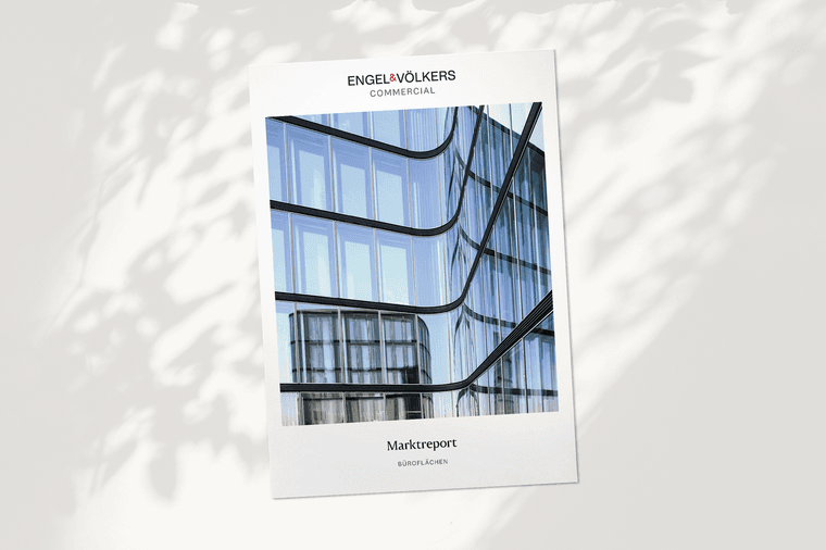 Cover of a commercial market report by Engel & Völkers, featuring a modern glass building facade.