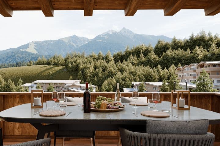 Terrace with set table and view of the Tyrolean mountains and Seefeld.