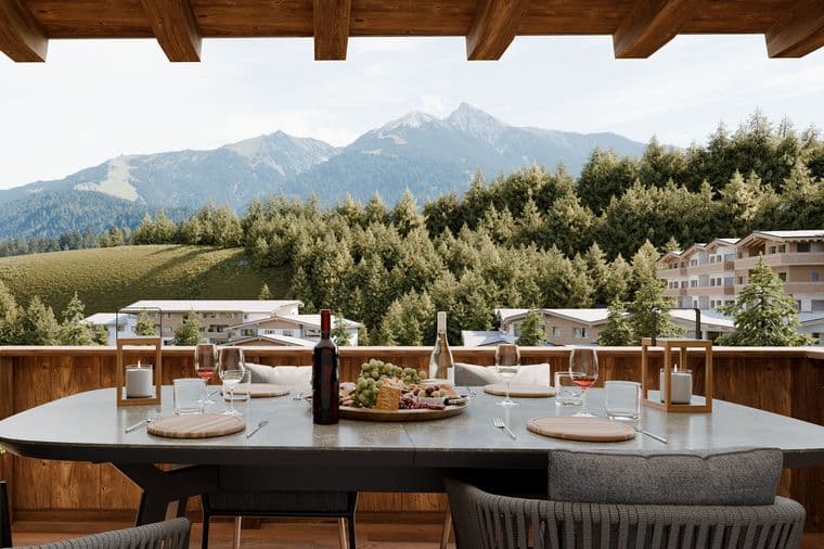 Terrace with set table and view of the Tyrolean mountains and Seefeld.