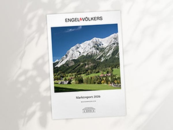 Engel & Völkers report cover showing alpine landscape: green valley, chalets, forest and snow‑capped mountains, titled "Marktreport 2026".