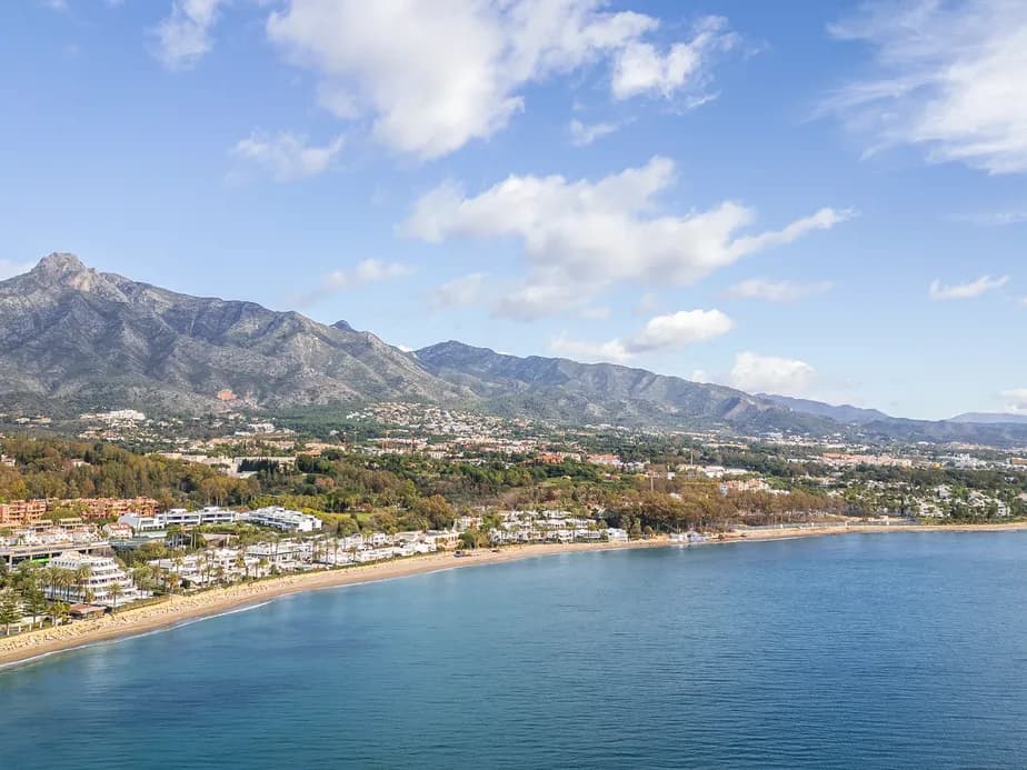 Aerial view of Marbella Golden Mile form the sea with La Concha mountain at the background