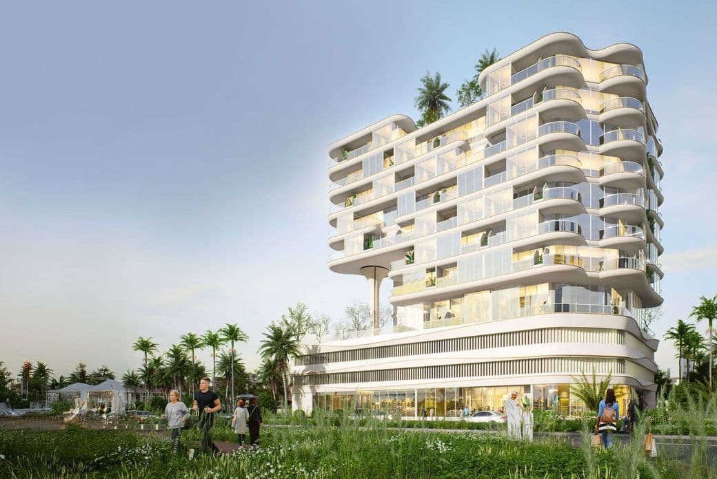 Modern, multi-story white building with curved balconies, surrounded by greenery and palm trees, people walking in the foreground.