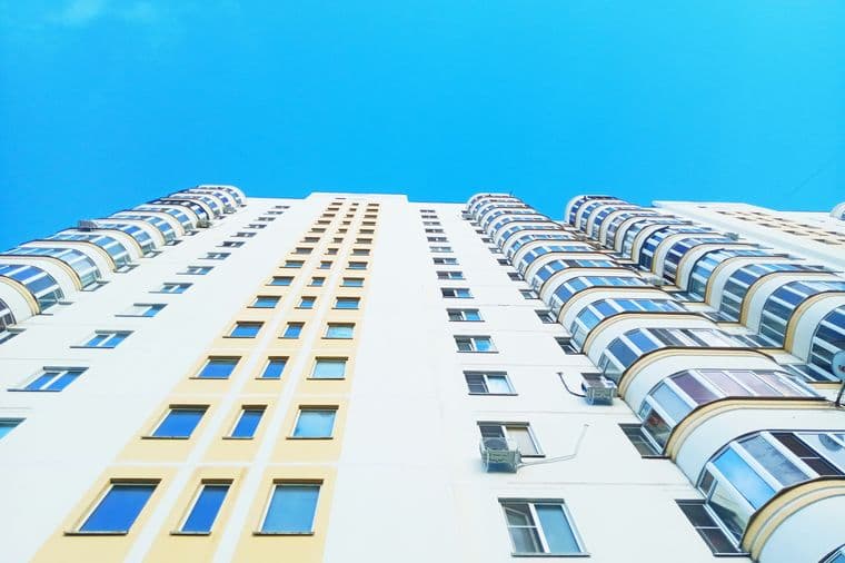 view of a high building, with lots of windows and no balconies