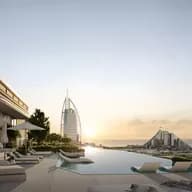Luxurious rooftop infinity pool with sun loungers, overlooking a city skyline and iconic modern buildings at sunset.