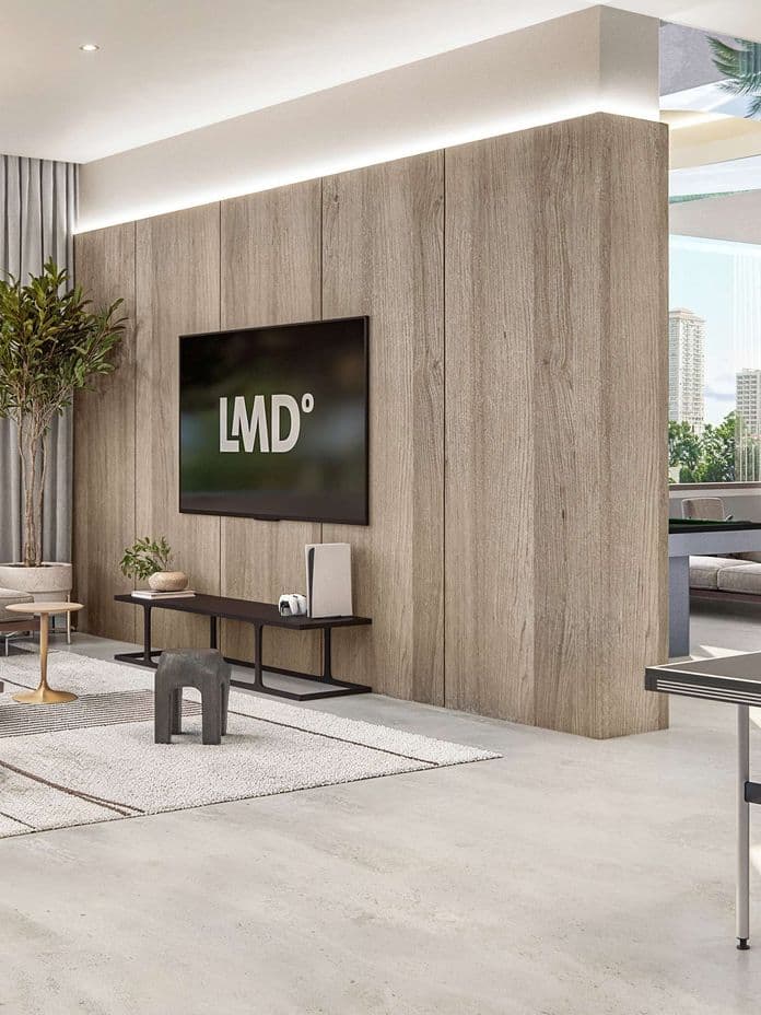 Bright communal lounge area at Taiyo Residences with modern seating, indoor greenery, a large TV, and a ping-pong table, designed for socializing and relaxation.