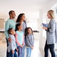 Showing family around a house