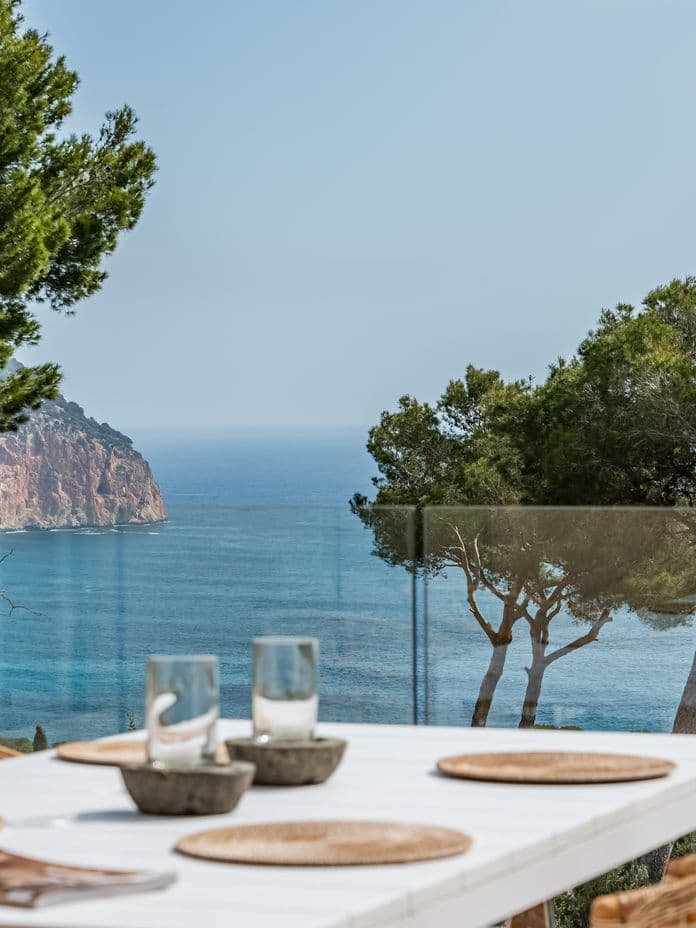Sea view terrace with dining table in Canyamel