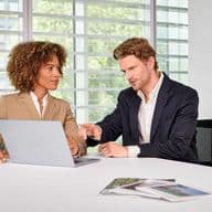 Customer service in the office with a view of a laptop