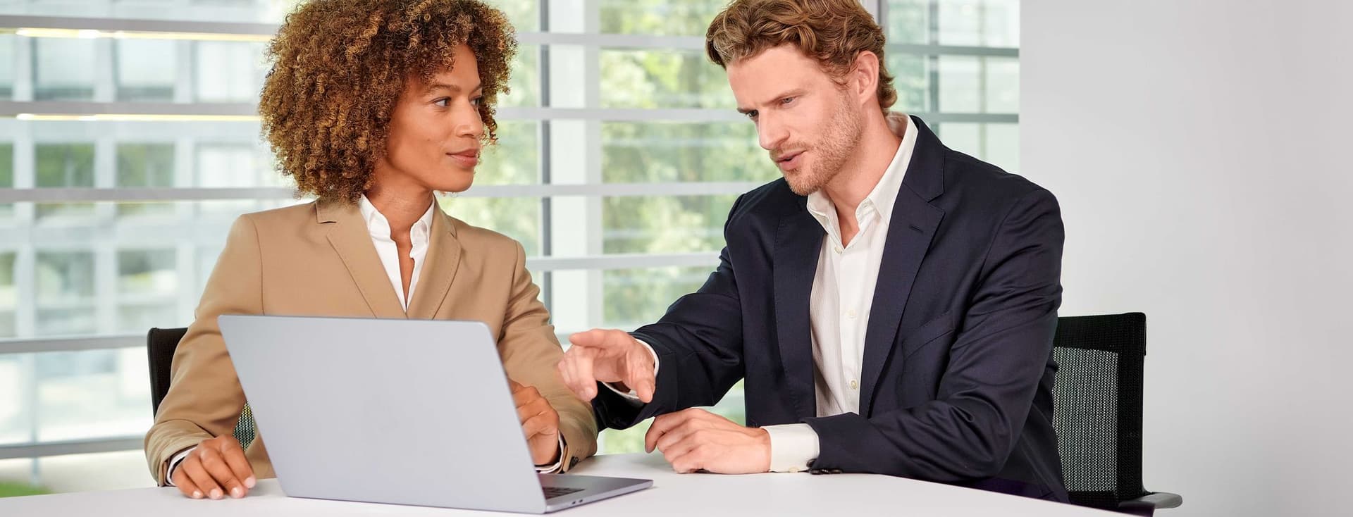 Customer service in the office with a view of a laptop